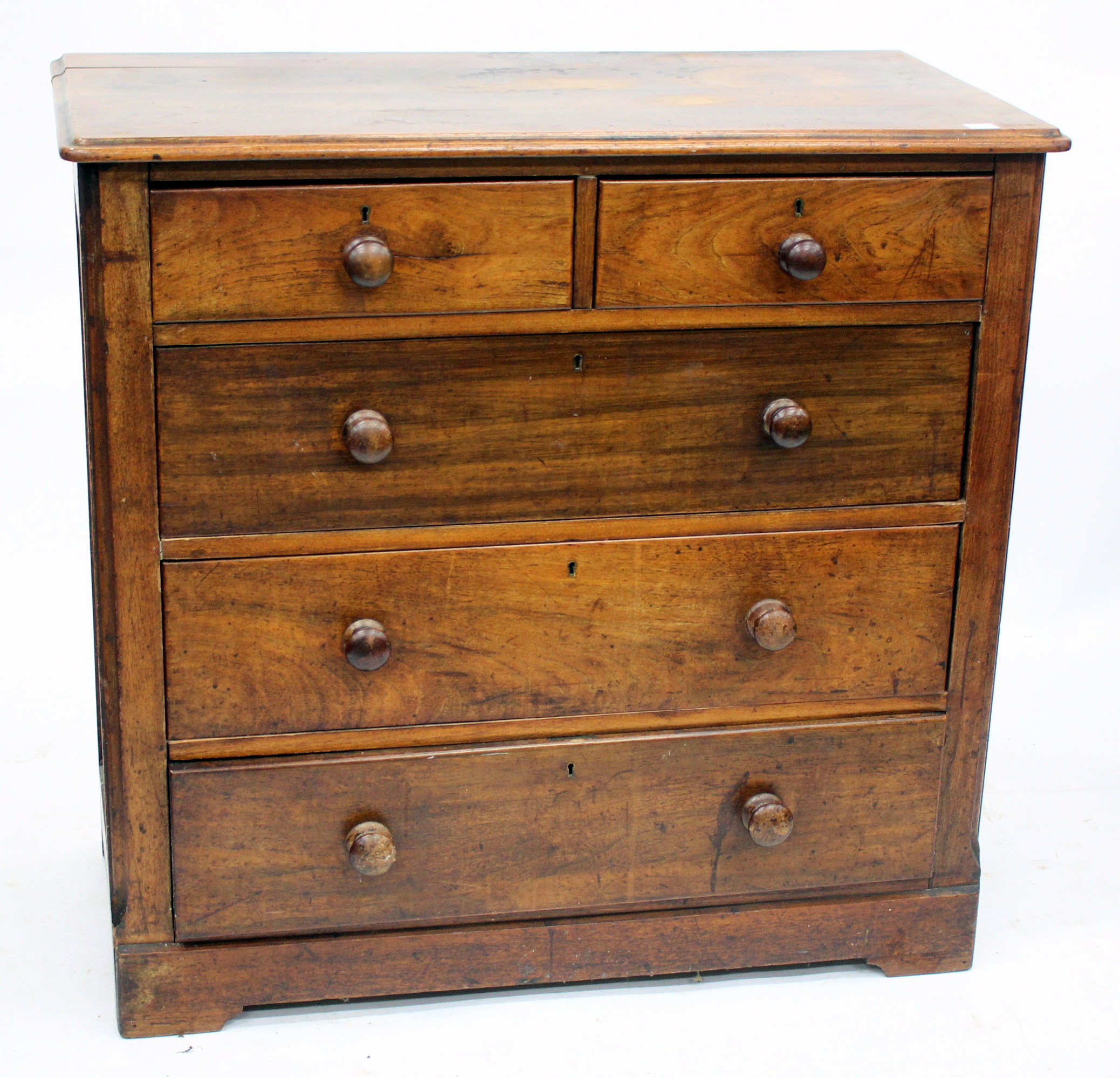 A VICTORIAN MAHOGANY CHEST of two short and three long drawers with turned knob handles and