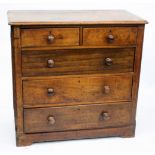 A VICTORIAN MAHOGANY CHEST of two short and three long drawers with turned knob handles and