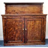 A VICTORIAN MAHOGANY CHIFFONIER with a raised back, two panelled doors and a plinth base 130cm wide