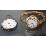 A 1920'S LADIES ROLEX WRISTWATCH with a 15 carat gold case, the enamelled dial with Roman