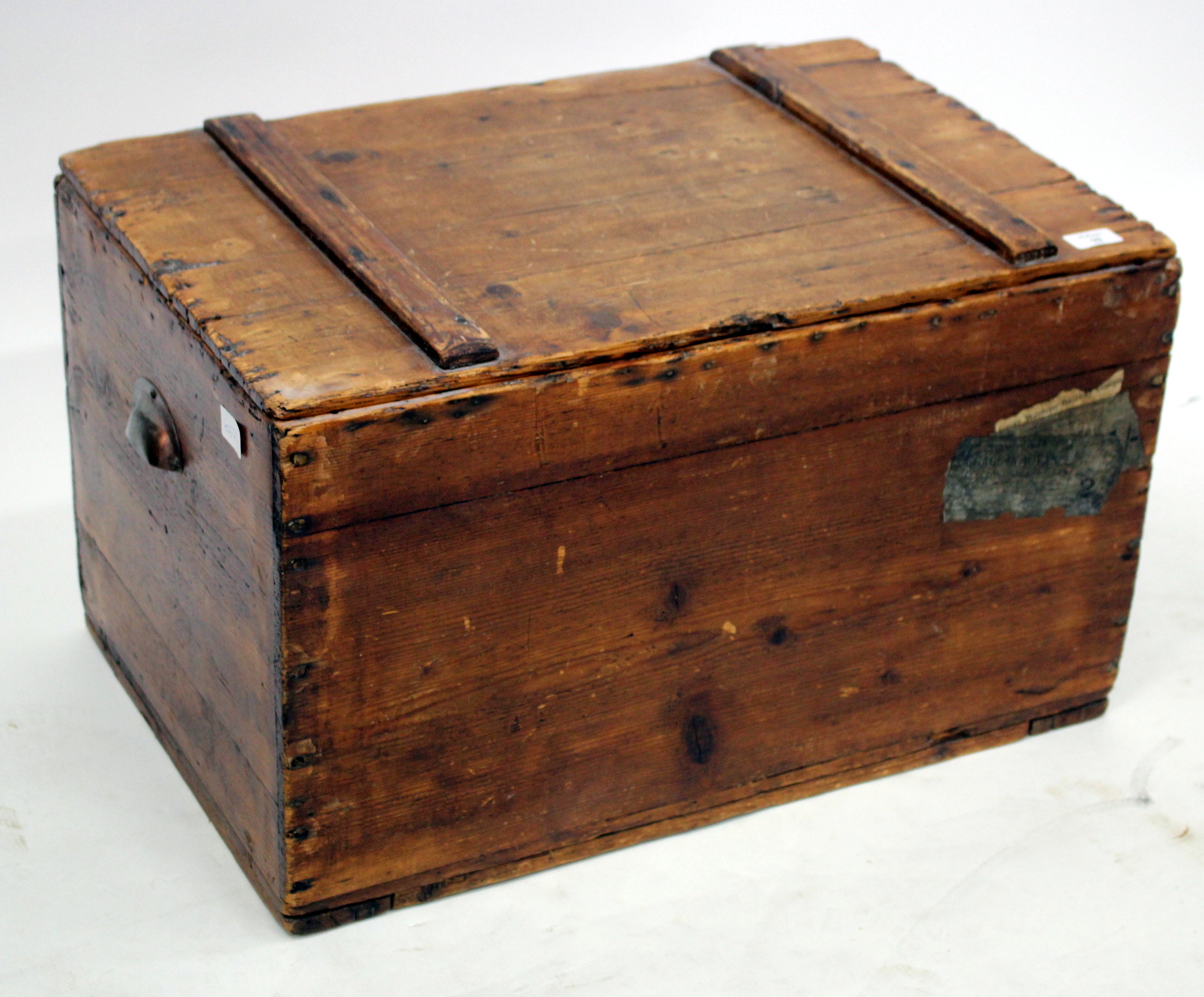 A 19TH CENTURY PINE CHEST with a lifting lid, 66cm wide