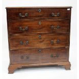 AN EARLY 19TH CENTURY MAHOGANY CHEST OF FOUR LONG DRAWERS with crossbanded top and standing on