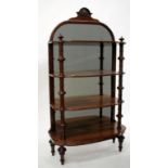 A VICTORIAN MAHOGANY AND WALNUT WHATNOT, the mirrored back with arching top and shaped crest with