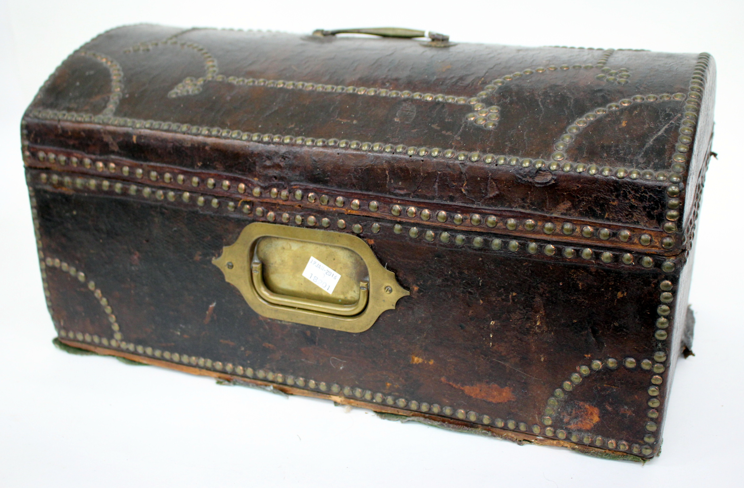 A GEORGIAN STUDDED LEATHER BOUND DOME TOPPED SMALL TRUNK with original retailers label, 'The