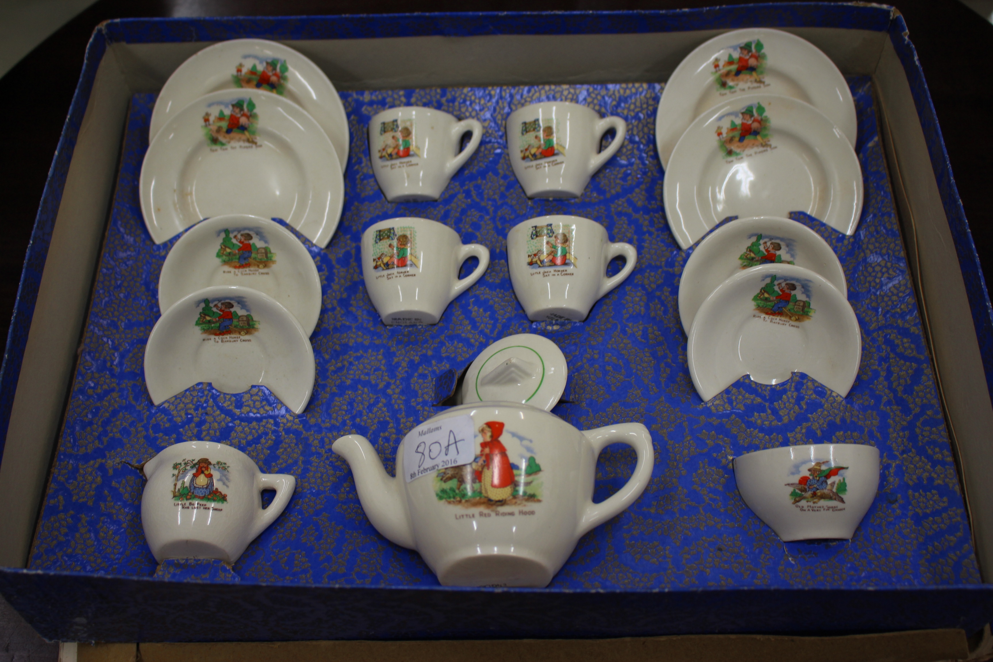 A MID 20TH CENTURY CHILD'S TEA SET decorated with pictures from nursery rhymes, in original box