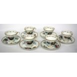 SIX 19TH CENTURY PORCELAIN CUPS AND SAUCERS, each with hand painted floral decoration and gilding