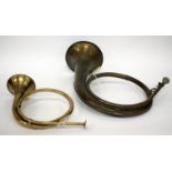 A 19TH CENTURY FRENCH BRASS HUNTING HORN 41cm wide, a further antique brass hunting horn (2)