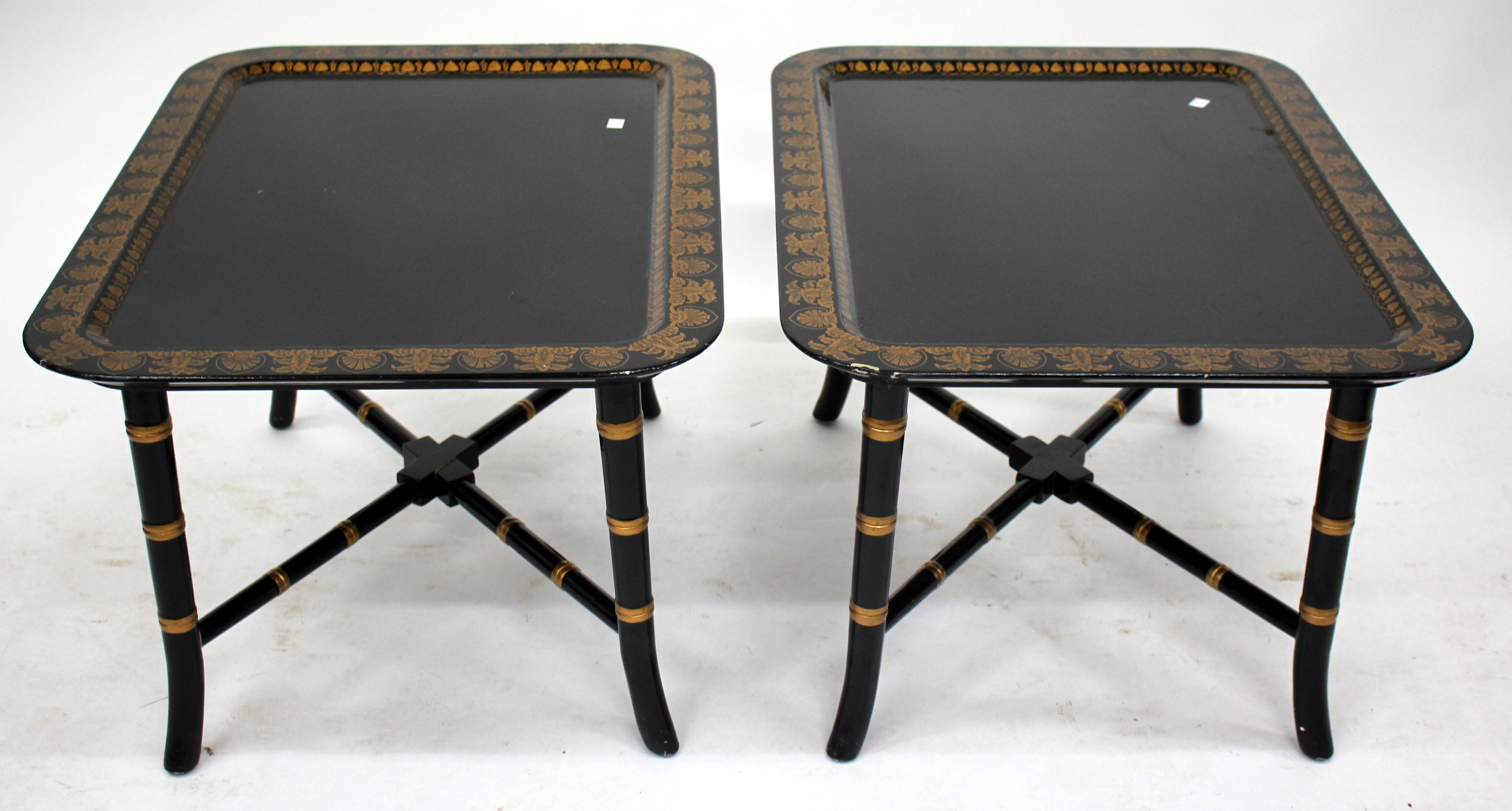 A PAIR OF 20TH CENTURY LACQUERED TRAY TOP TABLES with gilded decoration and faux bamboo supports,