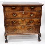 AN 18TH CENTURY WALNUT CHEST of two short and three long drawers with brass swan neck handles, a