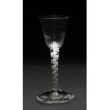 A GEORGIAN CORDIAL GLASS with gadrooned bowl, lace twist stem and circular spreading foot, 15.5cm