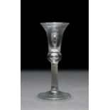 AN 18TH CENTURY CORDIAL GLASS with flaring bell shaped bowl, cable twist decoration to the stem