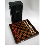 A JAQUES 7 SON STATUS QUO MAHOGANY CASED CHESS SET with original but tatty outer cover with a