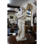 A LATE 19TH / EARLY 19TH CENTURY CARVED ALABASTER FIGURE of a standing maiden 61cm in height (
