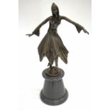 A CONTEMPORARY BRONZE SCULPTURE OF AN ART DECO STYLE DANCING GIRL with beaded cap and cuffs and