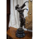 A CONTEMPORARY BRONZE SCULPTURE OF A DANCING GIRL, her hair in bunches and with flowers, the