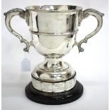 A VICTORIAN SILVER TROPHY CUP with twin scrolling handles, marks for London 1877 and marked '