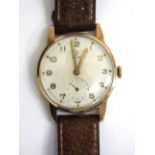 A 9 CARAT GOLD CASED TUDOR WRIST WATCH, the engine turned dial with Arabic numerals and subsidiary