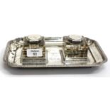 AN EDWARDIAN SILVER INKSTAND the tray with gadrooned edge and re-entrant corners, the square glass