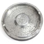 AN ALUMINIUM CIRCULAR ASHTRAY constructed from a Merlin engine piston with an inscription relating