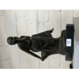 A CONTEMPORARY BRONZE SCULPTURE of a seated girl on a black marble base, 38cm in height