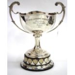 AN EARLY 20TH CENTURY SILVER TROPHY CUP with two scrolling handles and made by James Deakin &