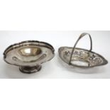 A SILVER TAZZA with a looped handle and a shaped top on a circular foot, marks for Sheffield 1913,