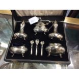 A QUANTITY OF SILVER AND SILVER PLATED ITEMS to include cutlery and a silver plated cruet set