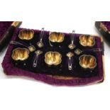 A SET OF SIX LOBED SILVER SALTS on ball feet, each 3cm wide together with matching spoons in a