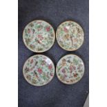 A SET OF FOUR CANTONESE FAMILLE ROSE PLATES decorated with flowers, exotic birds and insects, a