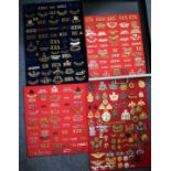 A COLLECTION OF WORLD WAR I AND LATER MILITARY SHOULDER TITLE BADGES to include two machine gun