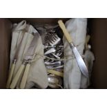 A QUANTITY OF SILVER PLATED CUTLERY to include a set of antique ivory handled fish knives and forks