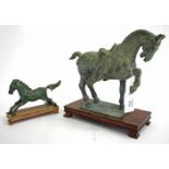 A PATINATED CAST BRONZE SCULPTURE of a prancing horse, copy of a Chinese original, 22cm high