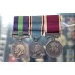 A REGULAR ARMY LONG SERVICE AND GOOD CONDUCT MEDAL and an Iraq General Service medal, each awarded