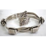 A SILVER 'ELEPHANT HAIR' BANGLE by Patrick Mavros and a Mexican silver ring (2)