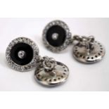 A PAIR OF SILVER CUFFLINKS with black enamel decoration and set with white stones