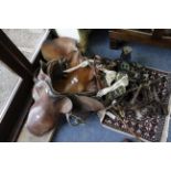 A LARGE ASSORTMENT OF HORSE BRIDLES, horse bits, two leather saddles and a selection of horse