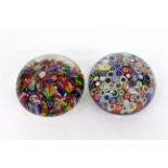 A MILLEFIORI PAPERWEIGHT, 7cm wide together with a further paperweight with scrambled canes (2)