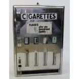 A VINTAGE PLAYERS CIGARETTE DISPENSER with chromium finish, 56cm x 82cm