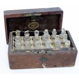 AN EARLY VICTORIAN MOROCCAN LEATHER CASED SET OF APOTHECARY BOTTLES from the H Wordsworth Chemist in