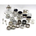 A QUANTITY OF VARIOUS SILVER SALT AND MUSTARD POTS and napkin rings