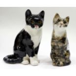 A POTTERY WINSTANLEY CAT with glass eyes 22cm high together with a further Winstanley cat 21cm high