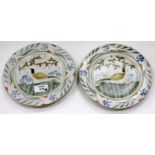 A PAIR OF LAWRENCE MCGOWAN STUDIO POTTERY STONEWARE PLATES with hand painted decoration of pheasants