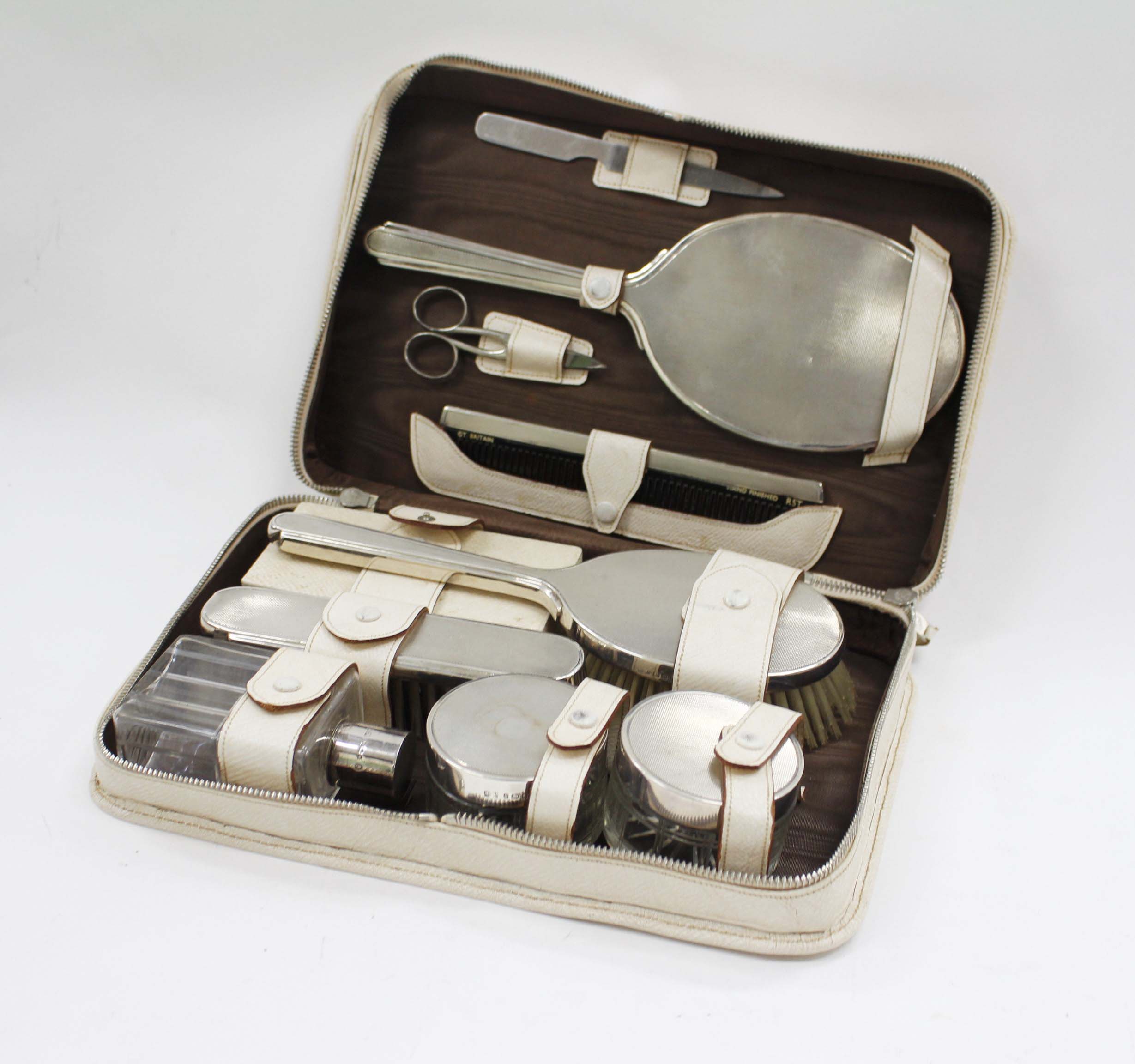 A LONDON SILVER MAPPIN AND WEBB DRESSING TABLE SET OR TRAVELLING GROOM SET congesting of mirrors,