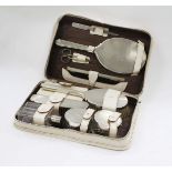 A LONDON SILVER MAPPIN AND WEBB DRESSING TABLE SET OR TRAVELLING GROOM SET congesting of mirrors,