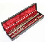 A CASED REGENT BOOSEY & HAWKES of London chromium plated flute with cleaning rod