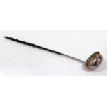 AN ANTIQUE WHITE METAL TODDY LADLE with twisted whalebone handle and set with a coin dated 1733