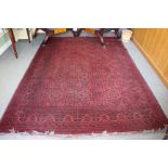 An Oriental Red Ground Rug