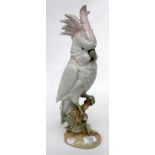 A ROYAL DUX CERAMIC COCKATOO FIGURINE with pink triangle mark to base and a green stamp with