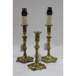 A PAIR OF 18TH CENTURY BRASS CANDLESTICKS later converted to lamps, each 21cm in height and a