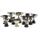 EIGHT EARLY 20TH CENTURY SMALL SILVER TROPHY CUPS from the Carlton Ladies Tennis Club and awarded to